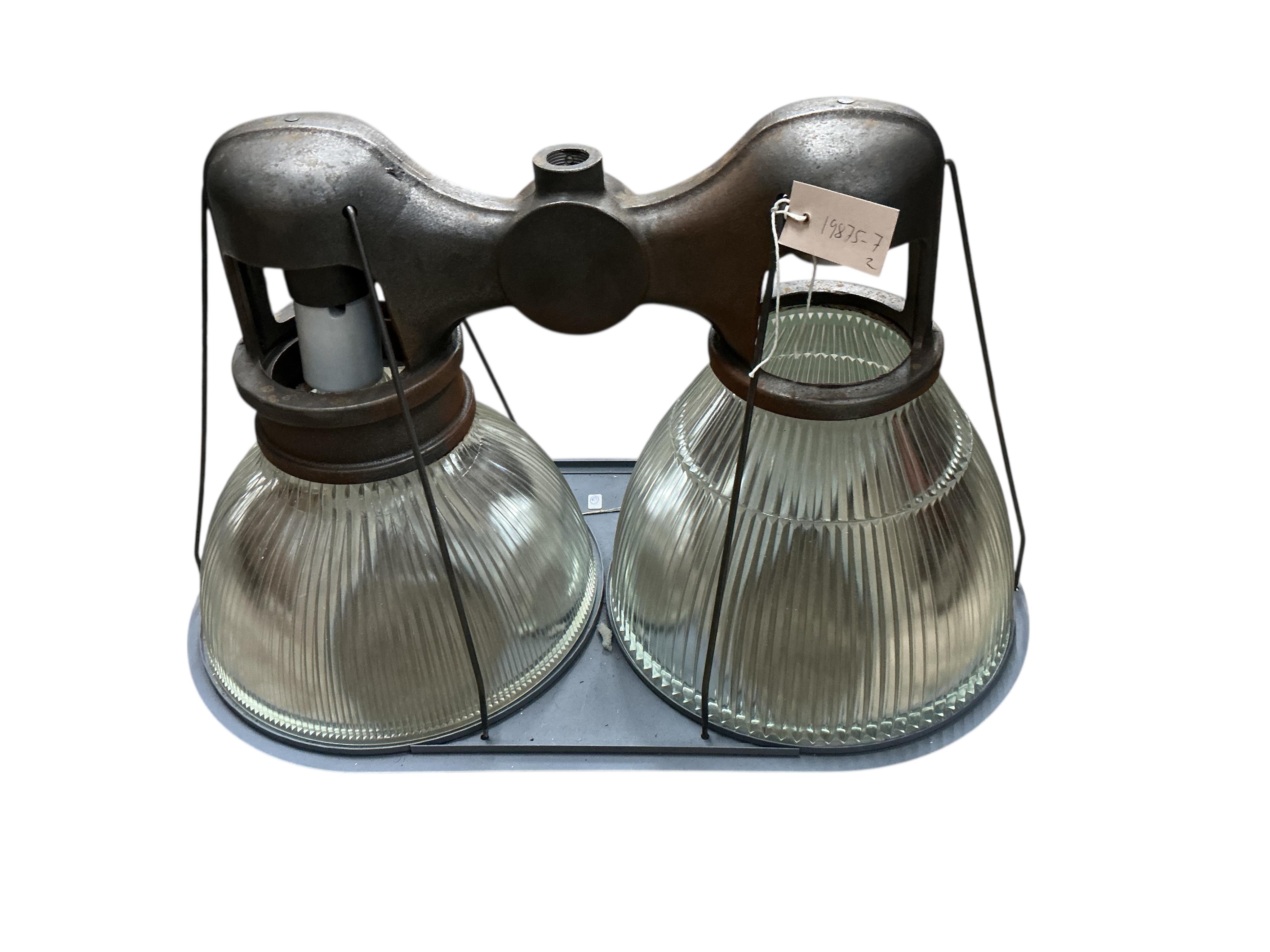 A pair of Holophane double industrial factory lights, width 64cm, height 42cm